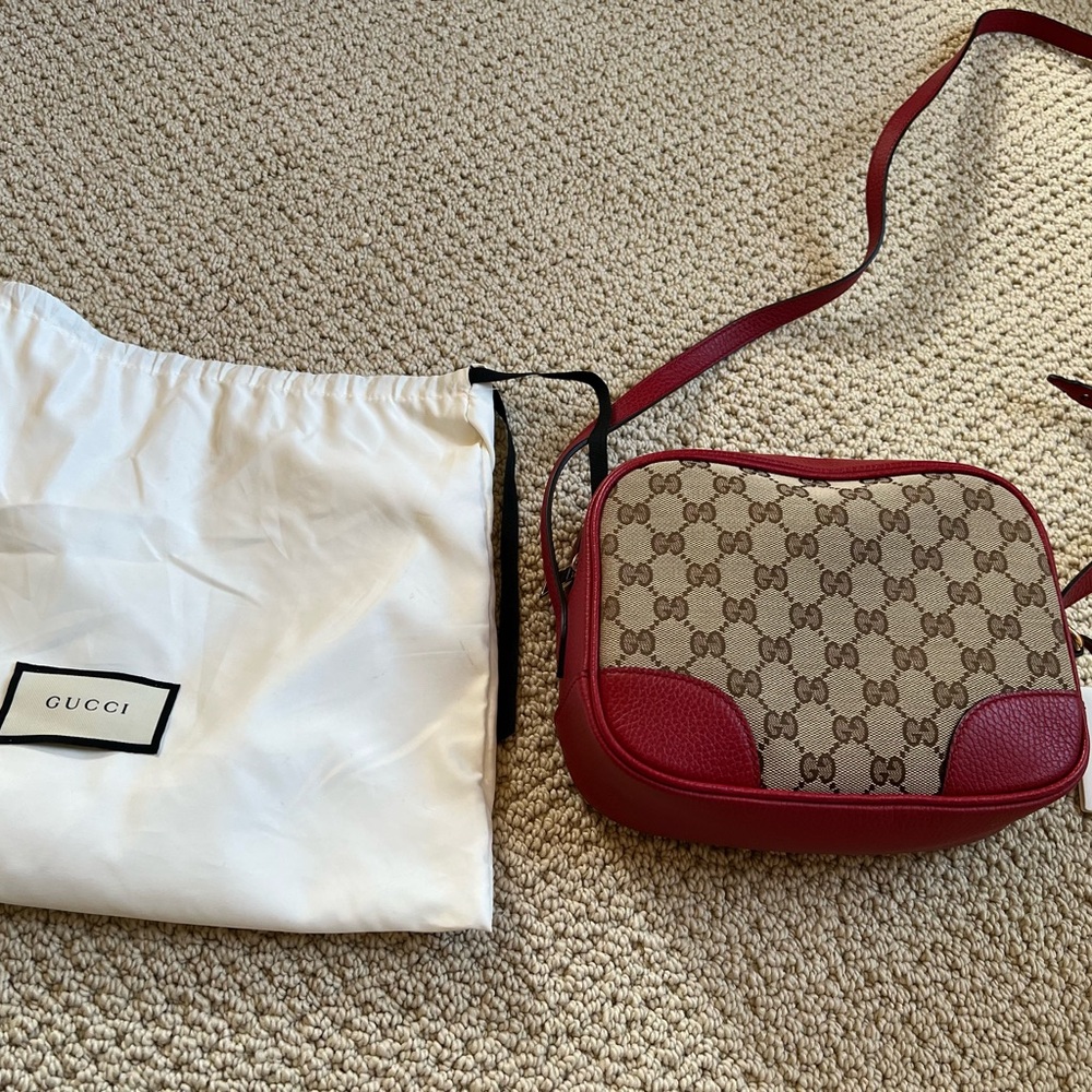 Gucci canvas camera bag in red. New and comes with dust bag.